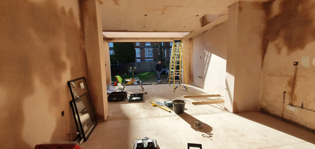 Home extension Tulse Hill SW2 – rear extension under construction showing warm roof structure and skylight opening
